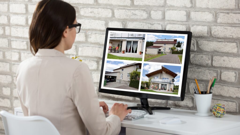 Buyer viewing real estate listing photos on a desktop computer, comparing properties in a price vs. no price marketing search.