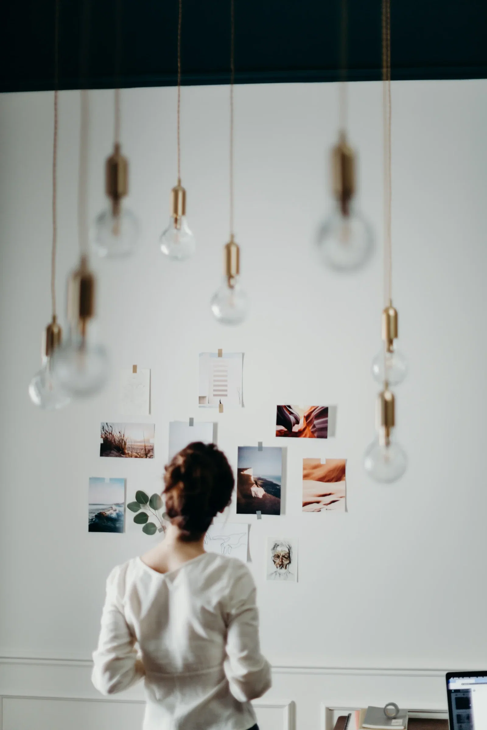 Girl in White looking at photos